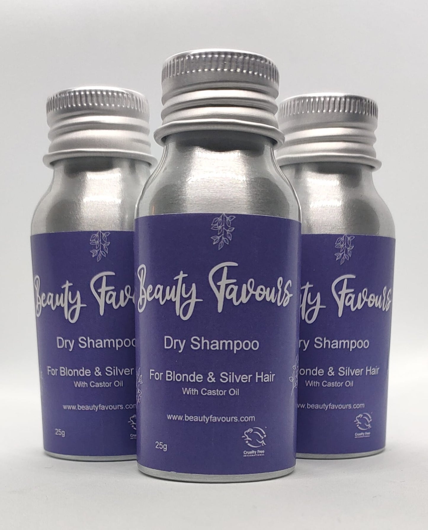 Three bottles of Beauty Favours dry shampoo for blonde and silver hair on a white background