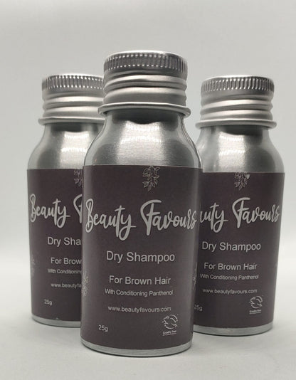 Three bottles of Beauty Favours dry shampoo for brown hair on a light gray background