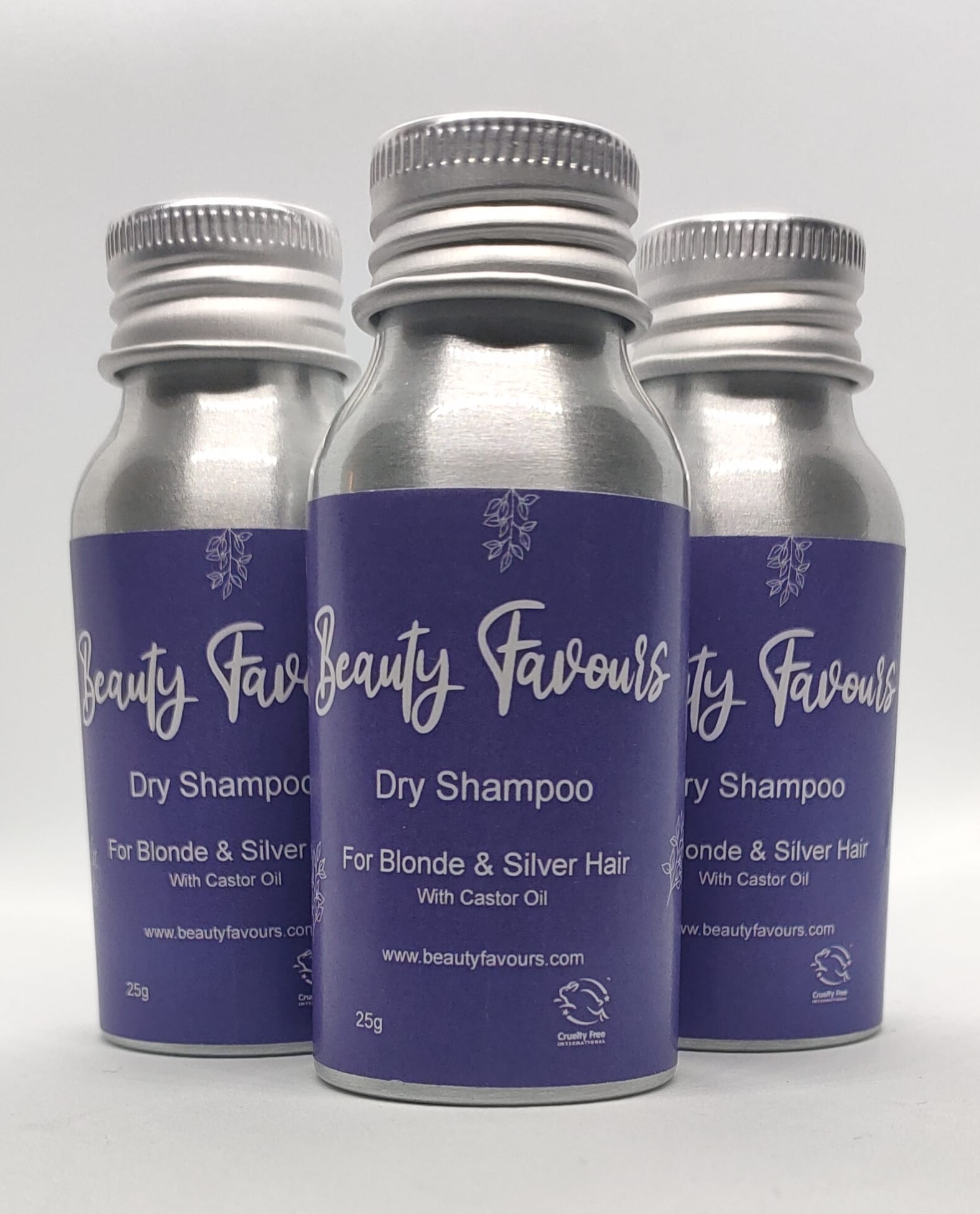 Three bottles of Beauty Favours dry shampoo for blonde and silver hair on a white background